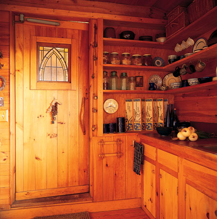 A window from an old California bungalow made its way to Kate’s kitchen door in Maine to remind her of her roots. Kate chose open shelving in her kitchen as a nod to old farmhouses. “I love to get access and see things—jars, dishes,” she says. “That harkens back to the farm mentality and peasant living; you have what you have, and it’s there.”